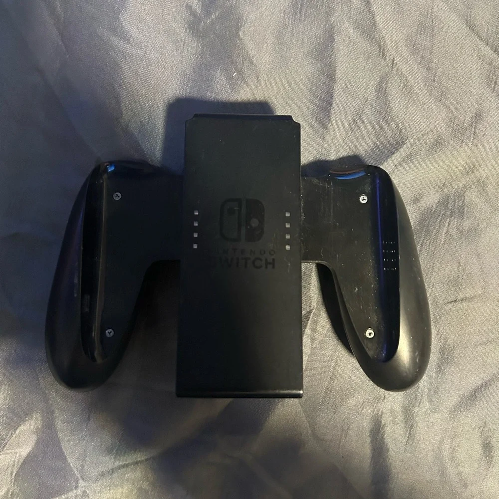 Nintendo Switch with gray Dock, Blue Kirby Case and Sonic Controller Accents,